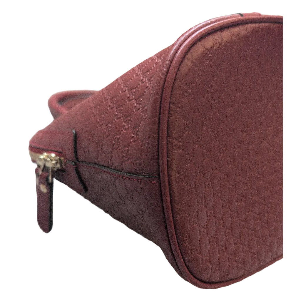 1 SIDE OF BOTTOM OF Pre-Owned Gucci GG Medium Red Top Handle Bag Guccissima