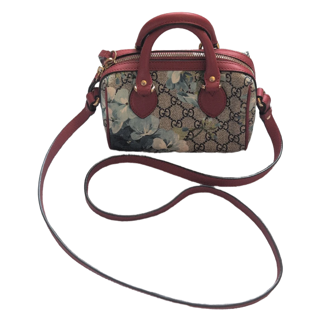 showing strap on Gucci GG Supreme Blooms Mini Boston bag
