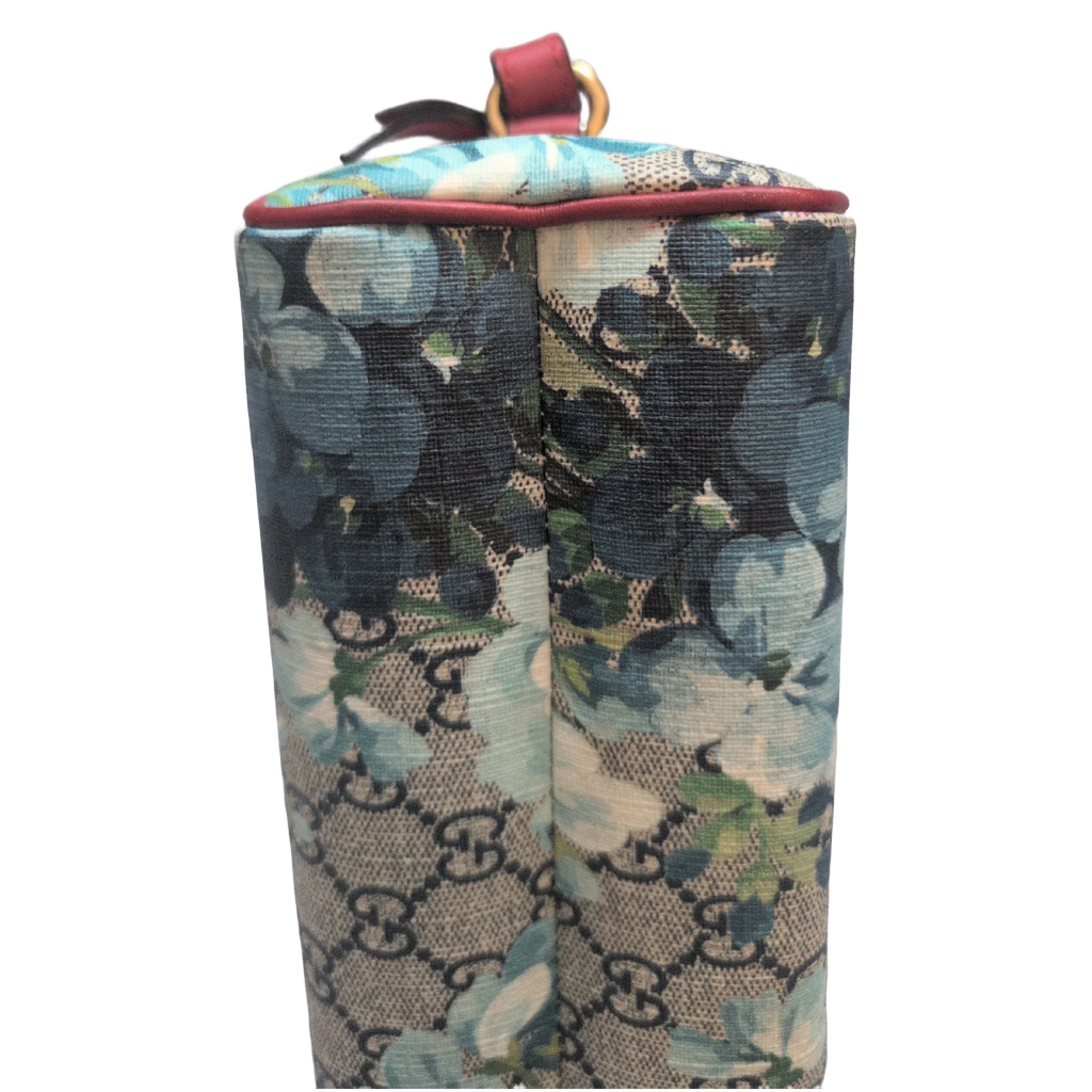 showing corners of Gucci GG Supreme Blooms Mini Boston bag