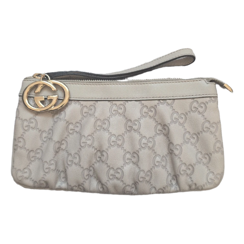 front of Pre-Owned Gucci Beige Leather Pouch Clutch