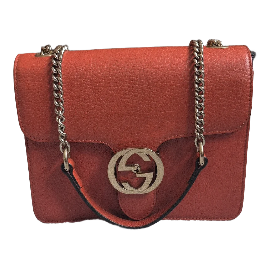front of Orange Gucci GG Interlocking Crossbody Bag 