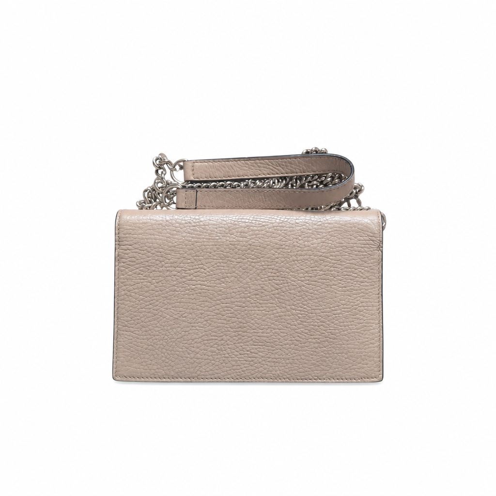 A rectangular pebbled leather clutch bag in a light taupe-beige color, featuring a silver-tone chain strap and a matching leather wristlet loop, shown against a plain white background. Pre-Owned Gucci Interlocking G Chain Wallet / Crossbody – Beige Pebbled Leather