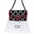 Gucci GG Marmont shoulder bag in black and white GG monogram canvas with red leather trim and a silver-tone horsebit clasp, displayed on a white dust bag with a Gucci dust bag label and an authenticity card. Pre-Owned Gucci Dionysus GG Tweed Medium Shoulder Bag – Red/Black