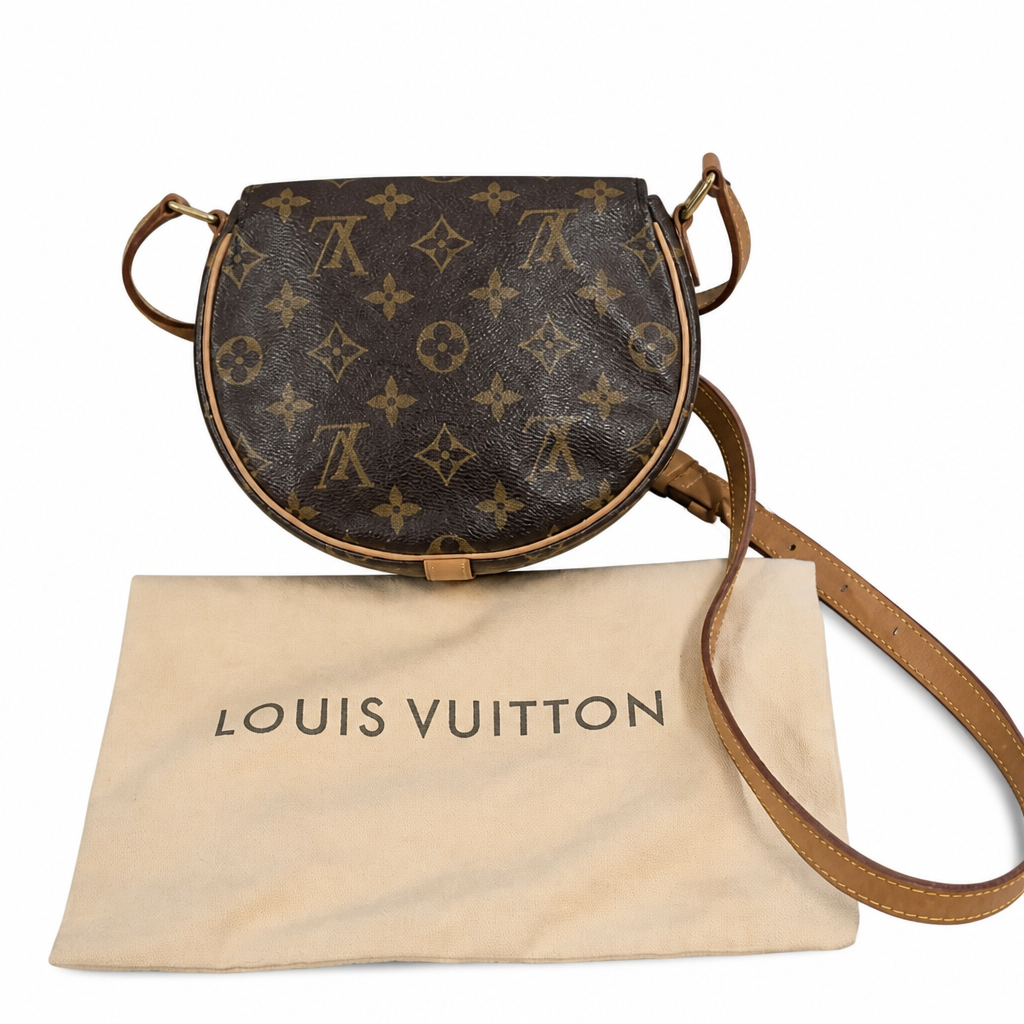 Louis Vuitton monogram canvas shoulder bag in dark brown with tan leather trim and strap, displayed with its beige dust bag on a white background. Pre-Owned Louis Vuitton Monogram Tambourin Shoulder / Crossbody Bag