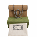 A Gucci shoulder bag in tan pebbled leather with a silver-tone chain strap and horsebit detail, displayed on top of a green Gucci box with a cream dust bag in front, all on a white background. Pre-Owned Gucci Dionysus Super Mini Crystal Tiger Head Chain Bag – Beige Leather