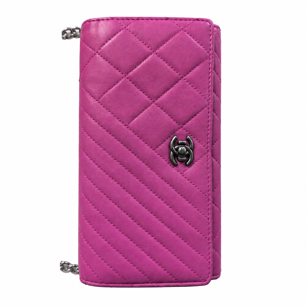 A quilted magenta pink leather wallet with a silver-tone interlocking CC logo clasp, featuring a chain strap attachment at the top and bottom corners, set against a plain white background. Pre-Owned Chanel Quilted Wallet on Chain WOC – Pink/Purple Lambskin – Silver Hardware