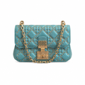 A turquoise blue quilted leather shoulder bag by Dior, adorned with gold studs and a gold-tone chain strap with a central lock closure. Pre-Owned Christian Dior Small DiorAddict Cannage Studded Flap Bag – Light Blue Lambskin