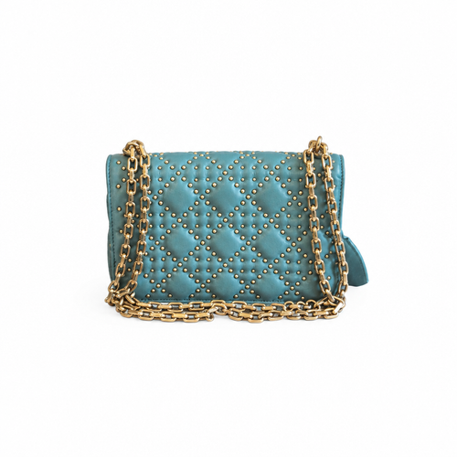 A teal quilted leather shoulder bag with gold-tone studs and a gold chain strap, shown against a plain white background. Pre-Owned Christian Dior Small DiorAddict Cannage Studded Flap Bag – Light Blue Lambskin