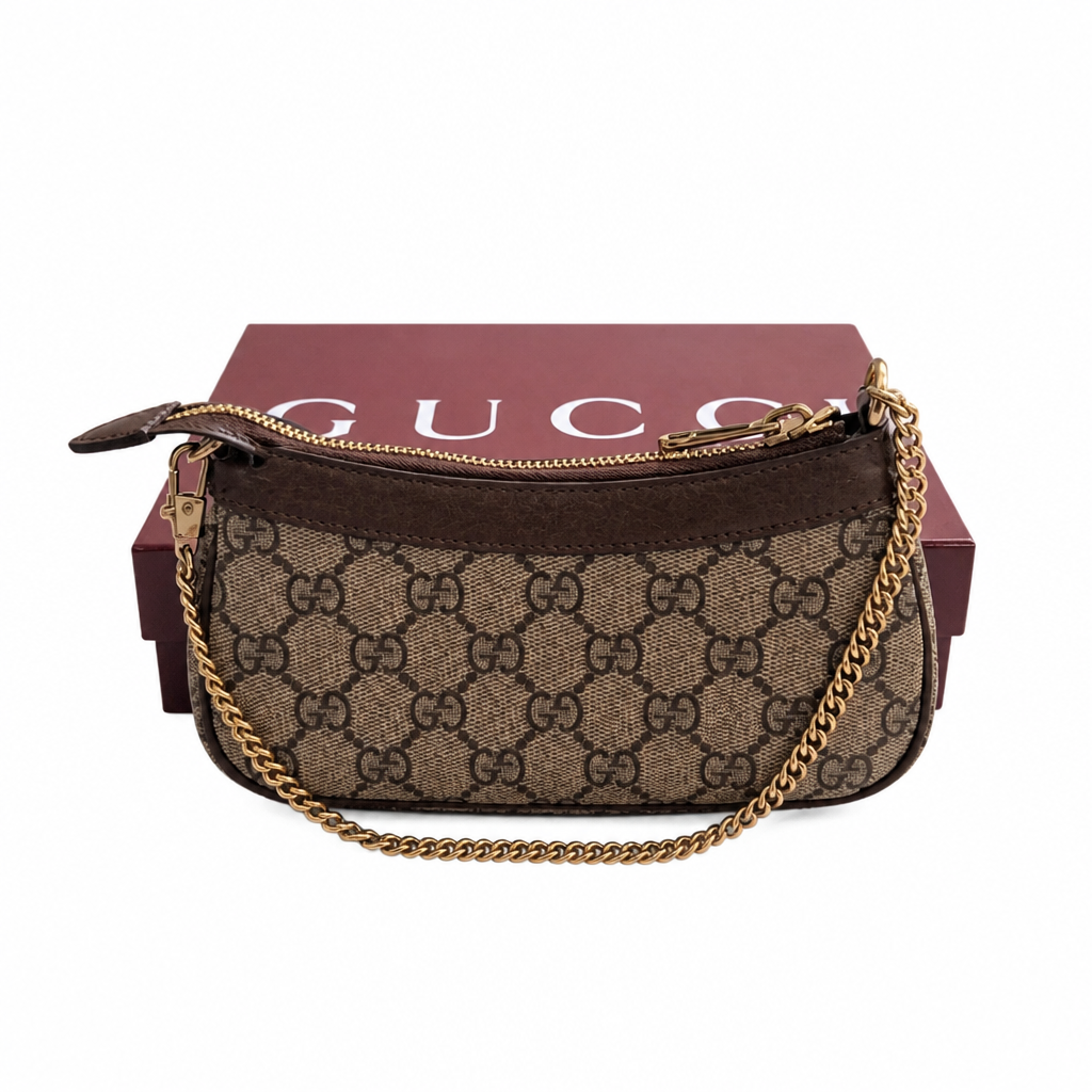 A Gucci GG Supreme canvas shoulder bag in brown and beige, featuring a gold-tone chain strap and gold hardware, displayed in front of its dark red Gucci box on a white background. Pre-Owned Gucci GG Supreme Ophidia Panda Mini Chain Shoulder Bag