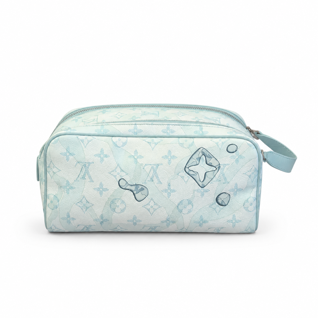 A light blue and white monogram toiletry bag with a zipper closure and a small matching handle, photographed on a clean white background. Pre-Owned Louis Vuitton x Richard Prince Limited Edition Monogram Bag – Spring/Summer 2008 – Pale Blue
