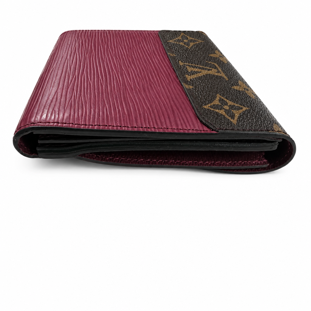 A folded Louis Vuitton wallet in a split design featuring textured burgundy Epi leather on the left and the classic brown monogram canvas on the right, set against a plain white background. Pre-Owned Louis Vuitton Portefeuille Marie-Rose Clutch Wallet – Fuchsia Epi Leather & Monogram Canvas