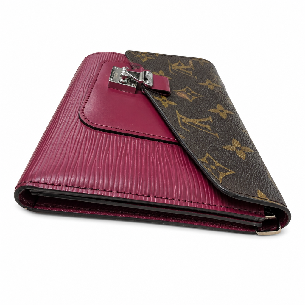 A luxury walletcover in magenta embossed leather and brown monogram canvas, featuring a silver-tone metal clasp, shown on a white background. Pre-Owned Louis Vuitton Portefeuille Marie-Rose Clutch Wallet – Fuchsia Epi Leather & Monogram Canvas