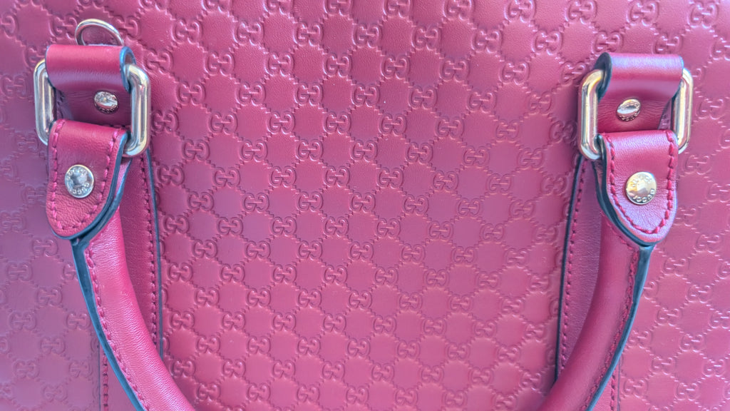showing hardware Pre-Owned Gucci GG Medium Red Top Handle Bag Guccissima