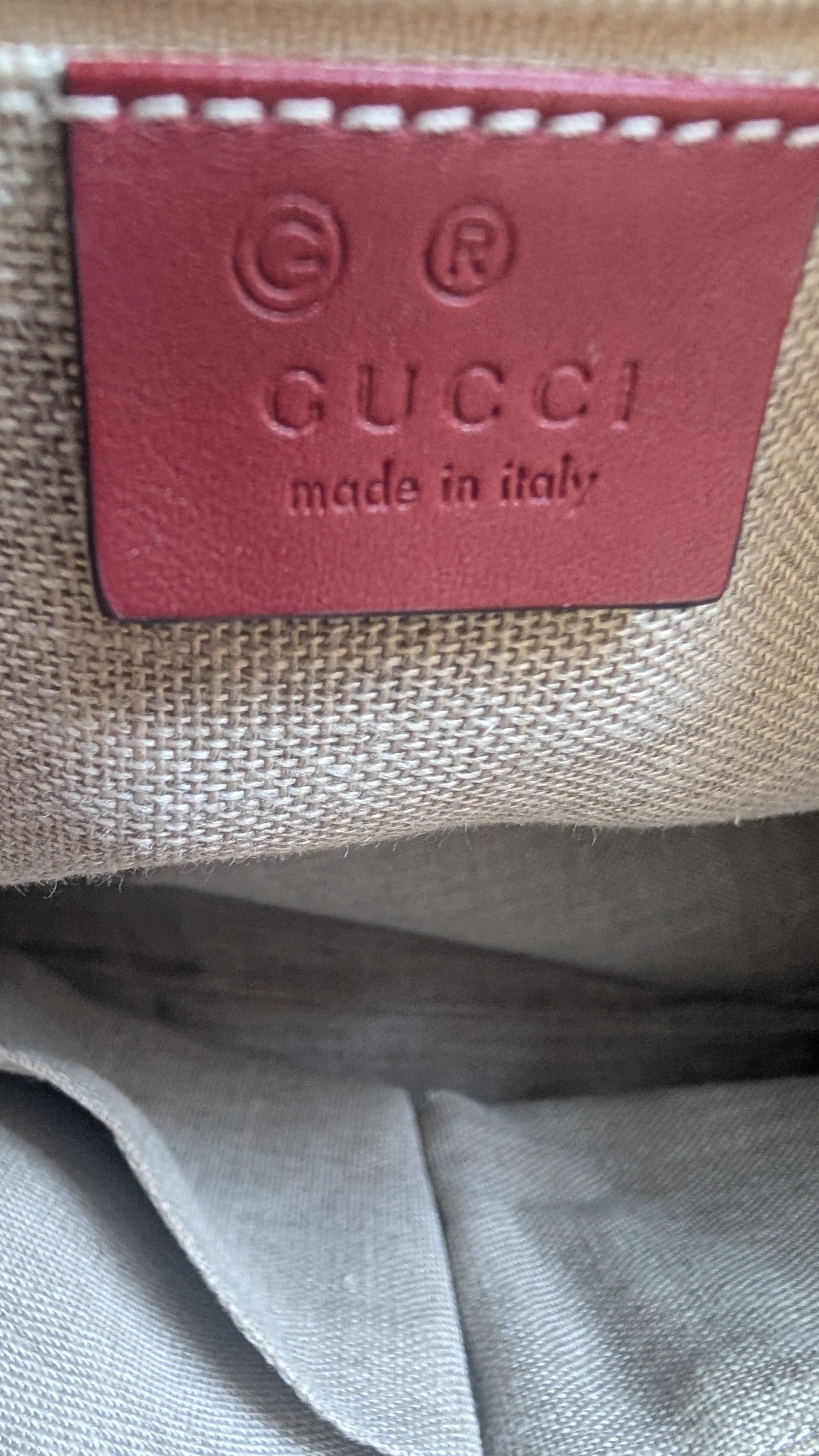 showing gucci brand label inside Pre-Owned Gucci GG Medium Red Top Handle Bag Guccissima