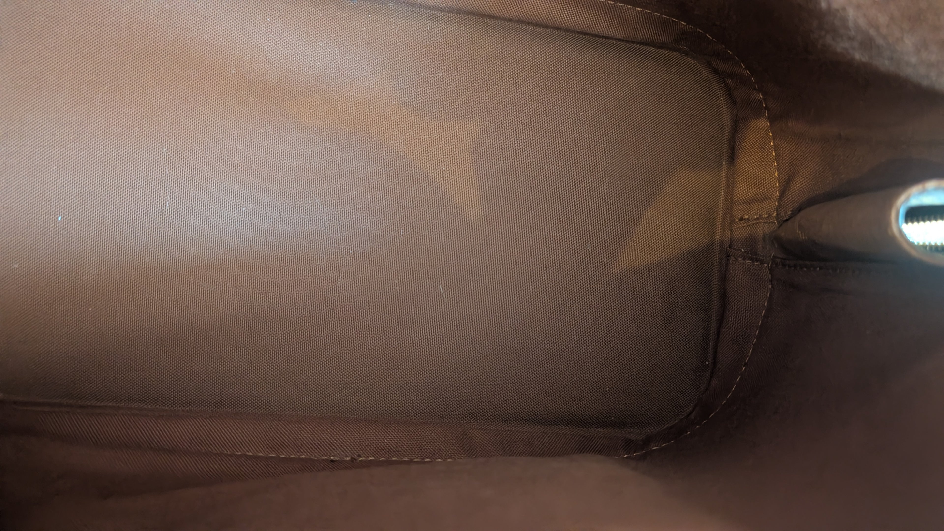 close up of the inside Pre-owned Louis Vuitton Alma PM Monogram Canvas