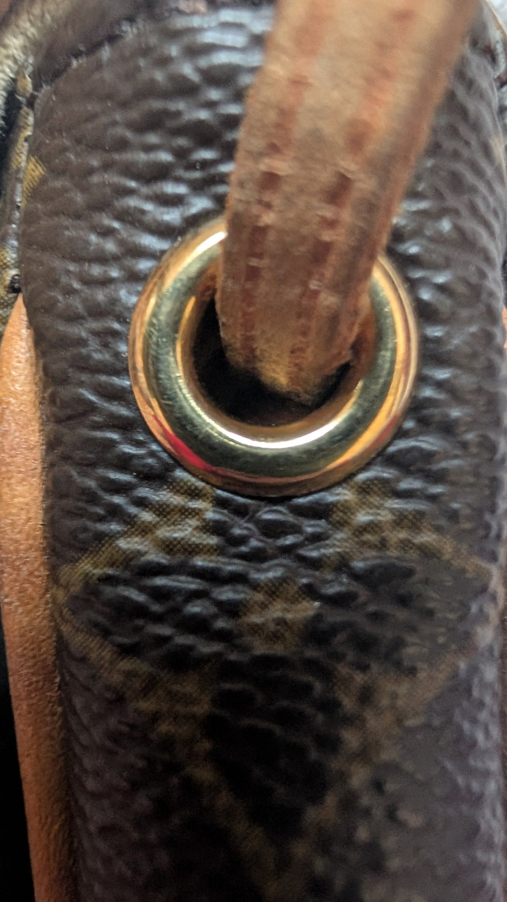 close up of leather Pre-Owned Louis Vuitton Monogram Pochette Cancun Shoulder Bag