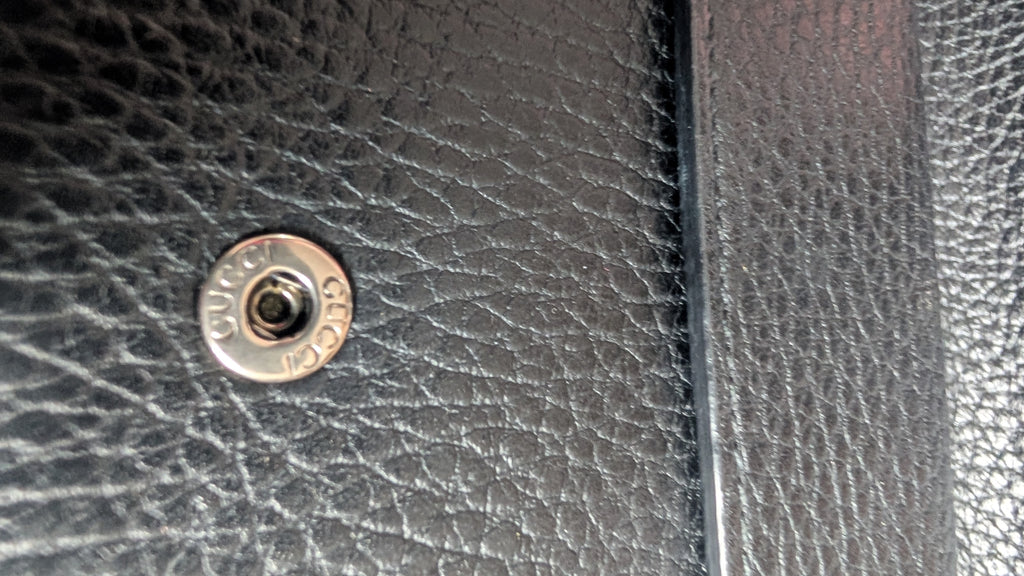 showing clasp sutter Pre-Owned Gucci Dionysus Black Pebbled Leather Mini Bag
