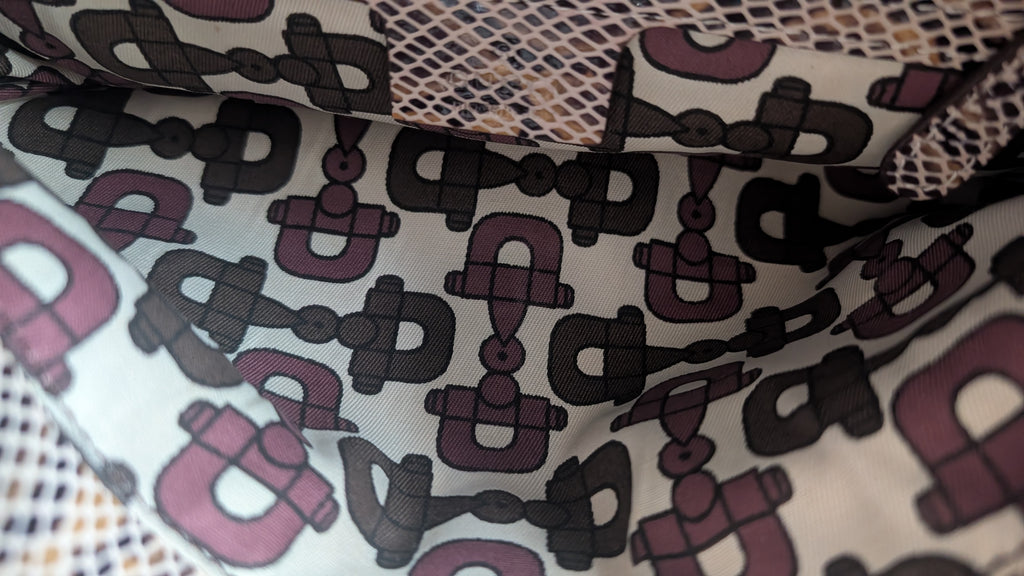 inside condition of Pre-Owned Gucci Python & Leather Croisette Bamboo Clutch Bag