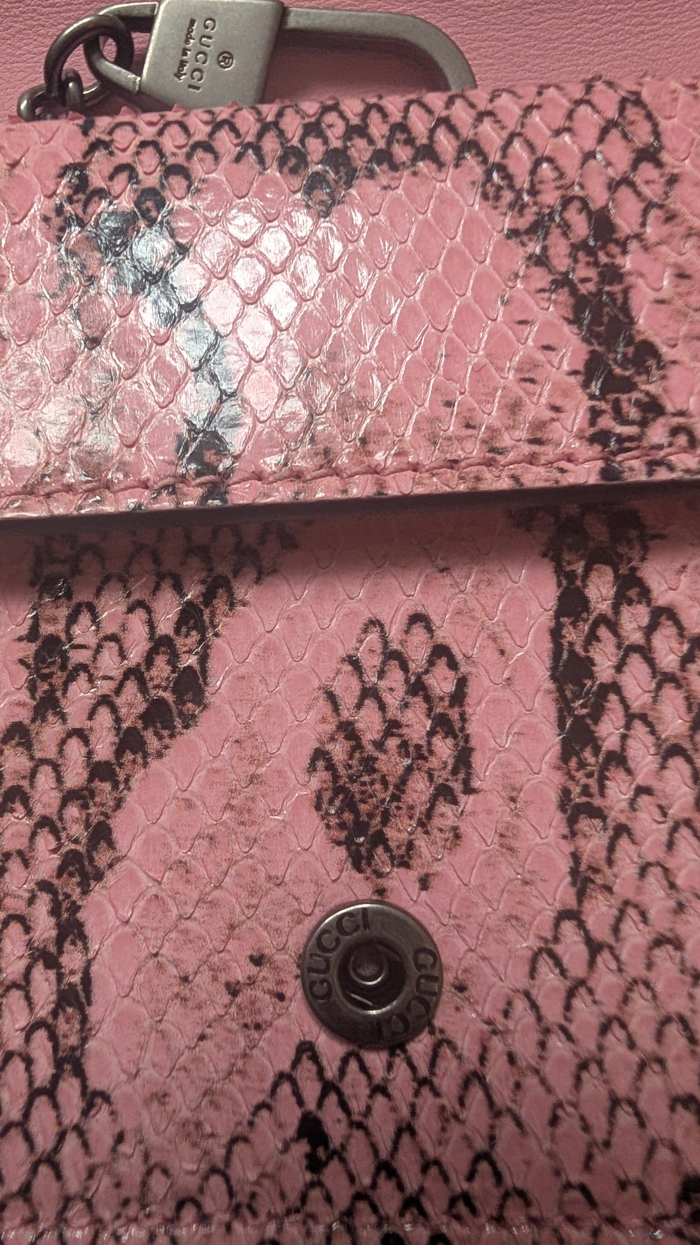 showing close up of the from popper Pre-Owned Gucci Dionysus Python Mini Pink Bag
