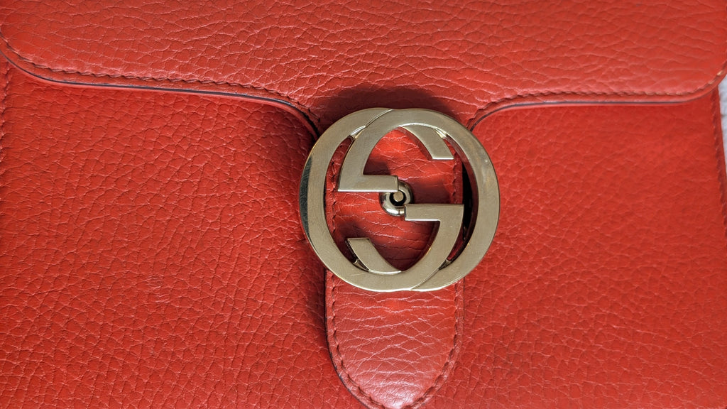 showing exterior marks Orange Gucci GG Interlocking Crossbody Bag 