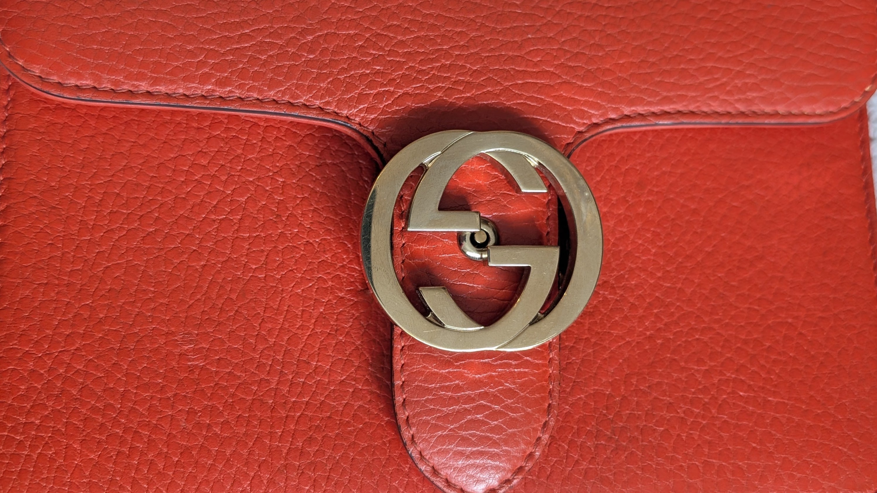 showing exterior marks Orange Gucci GG Interlocking Crossbody Bag 