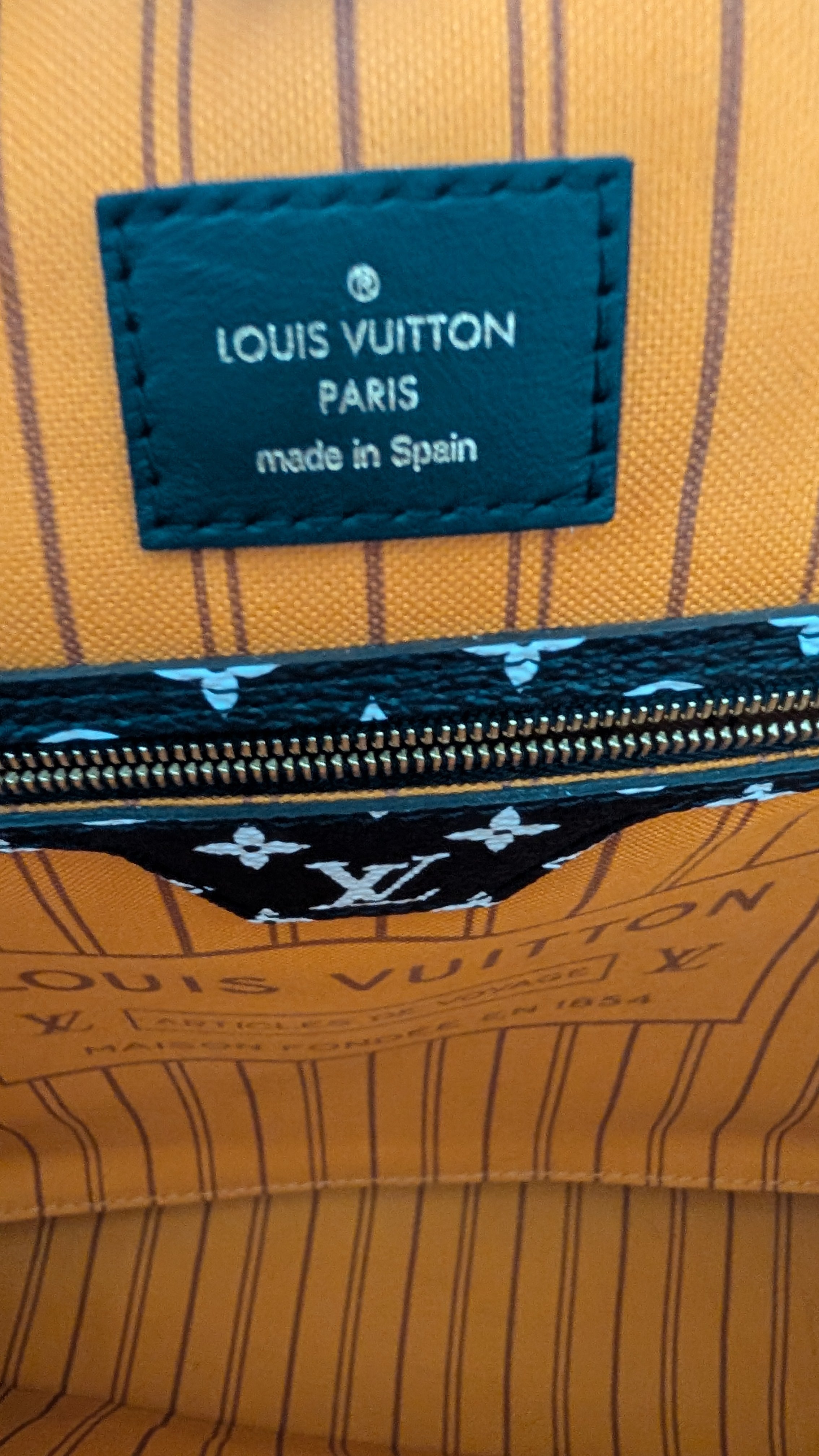 inside label Pre-Owned Louis Vuitton Jungle Neverfull MM Limited Edition with Matching Pouch