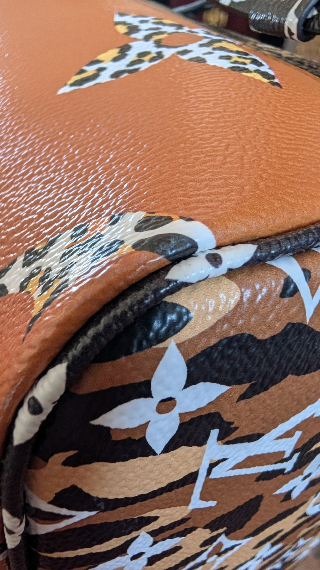 corner 3 Pre-Owned Louis Vuitton Jungle Neverfull MM Limited Edition with Matching Pouch
