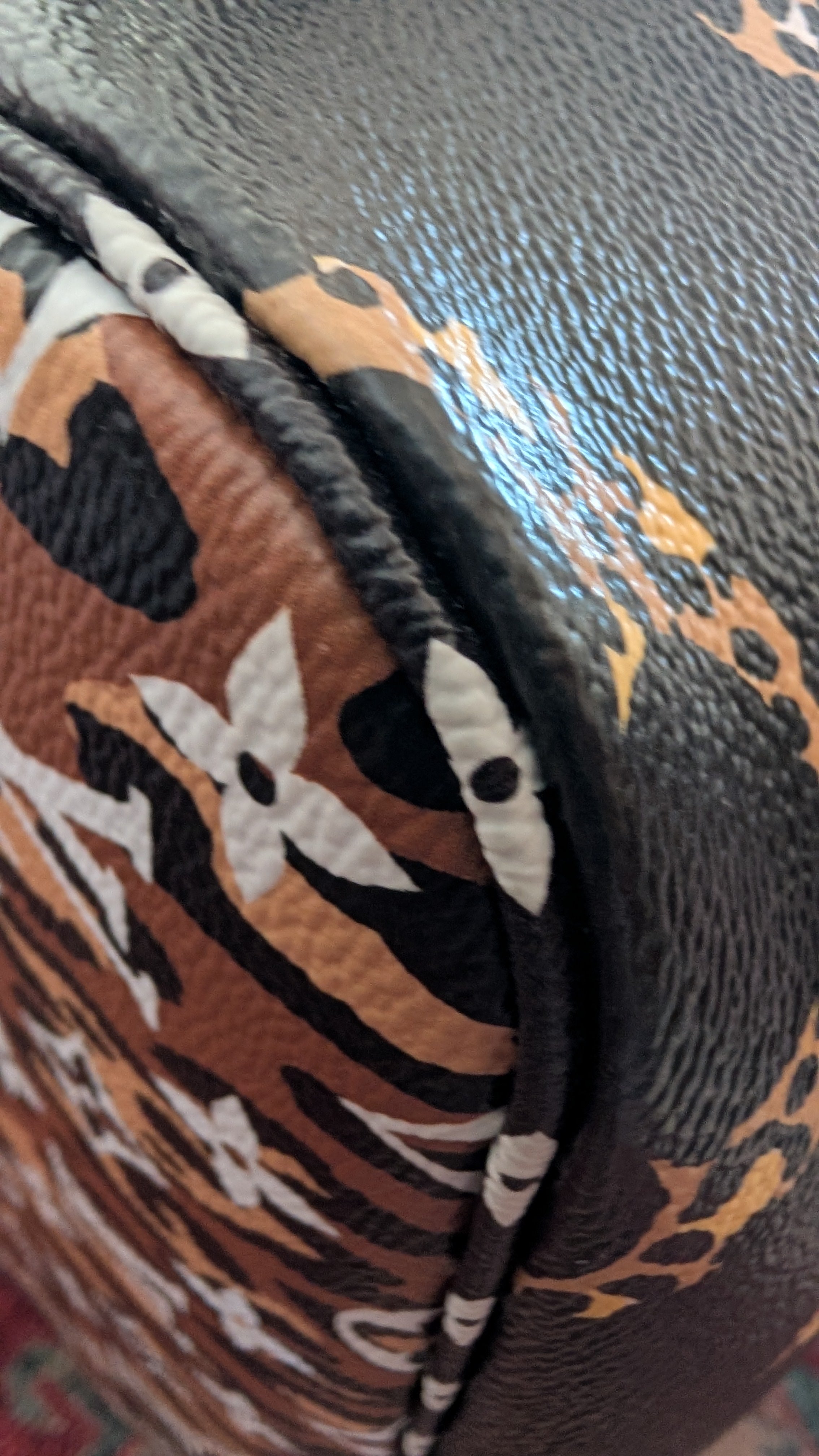 corner 4 Pre-Owned Louis Vuitton Jungle Neverfull MM Limited Edition with Matching Pouch