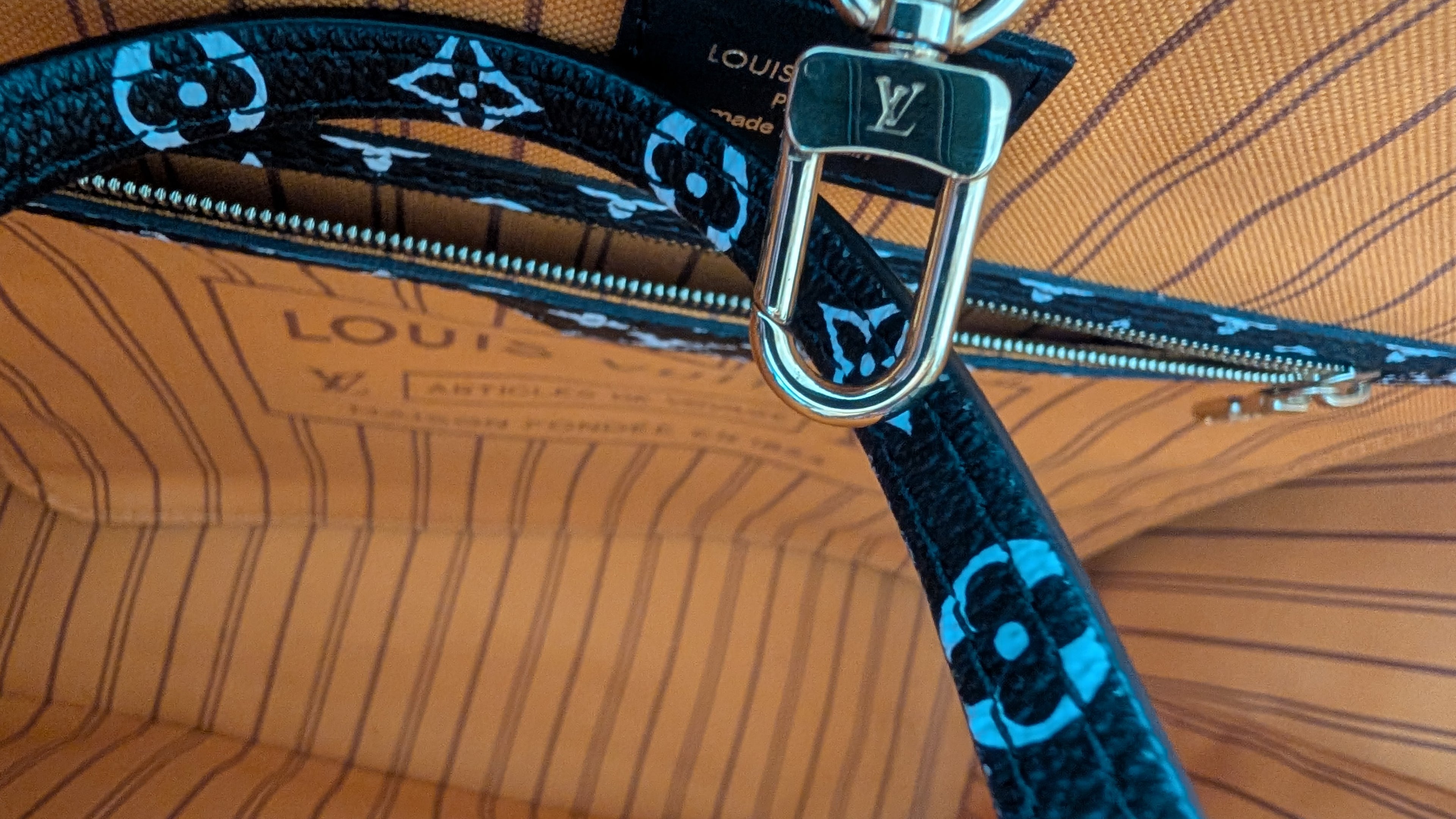 inside Pre-Owned Louis Vuitton Jungle Neverfull MM Limited Edition with Matching Pouch
