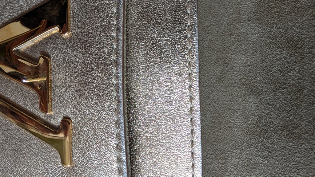 lv logo Pre-Owned Louis Vuitton Louise GM Clutch – Metallic Champagne Leather