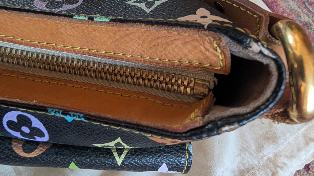 Close-up of a Louis Vuitton monogram canvas and leather pouch showing the interior zipper, tan leather lining, and gold-tone hardware. Pre-Owned Louis Vuitton Takashi Murakami Lodge PM Shoulder Bag