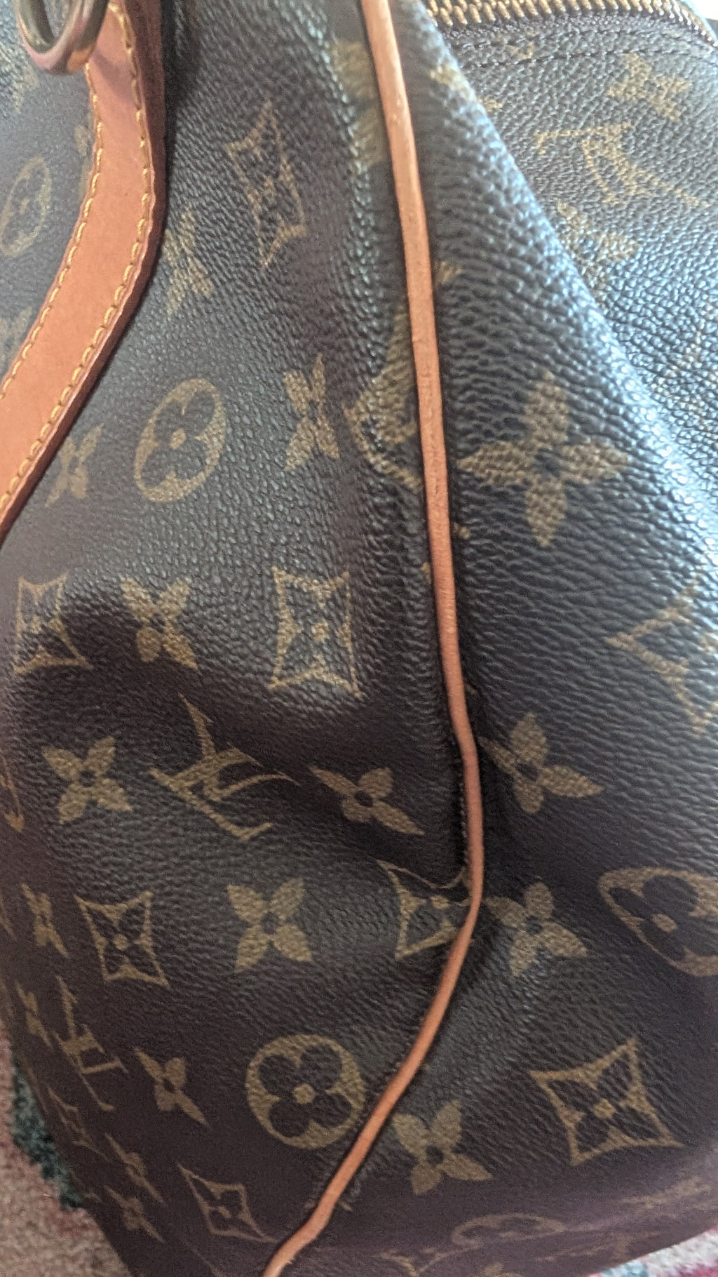 Close-up of a Louis Vuitton monogram canvas handbag in dark brown with tan leather trim and a gold zipper. Pre-Owned Louis Vuitton Keepall Bandoulière 60 Monogram Travel Bag
