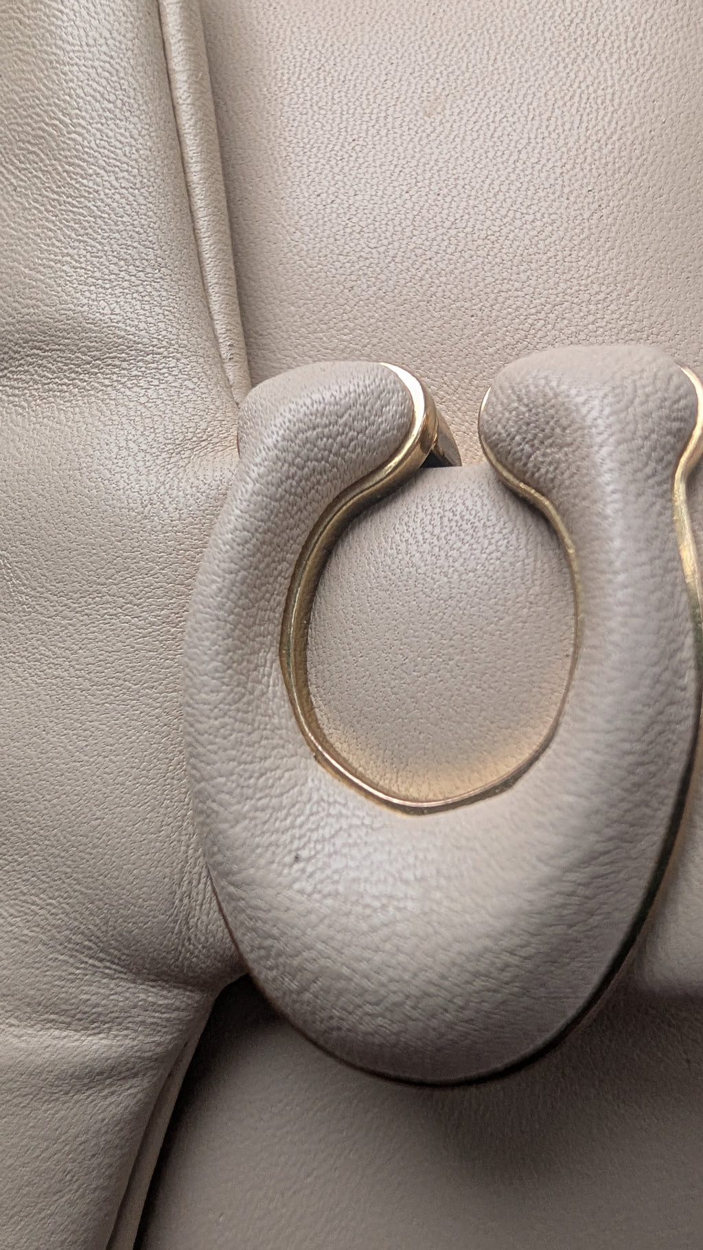 Close-up of a  textured leather bag Pre-Owned Coach Pillow Tabby Shoulder Bag – Cream/Ivory Leather