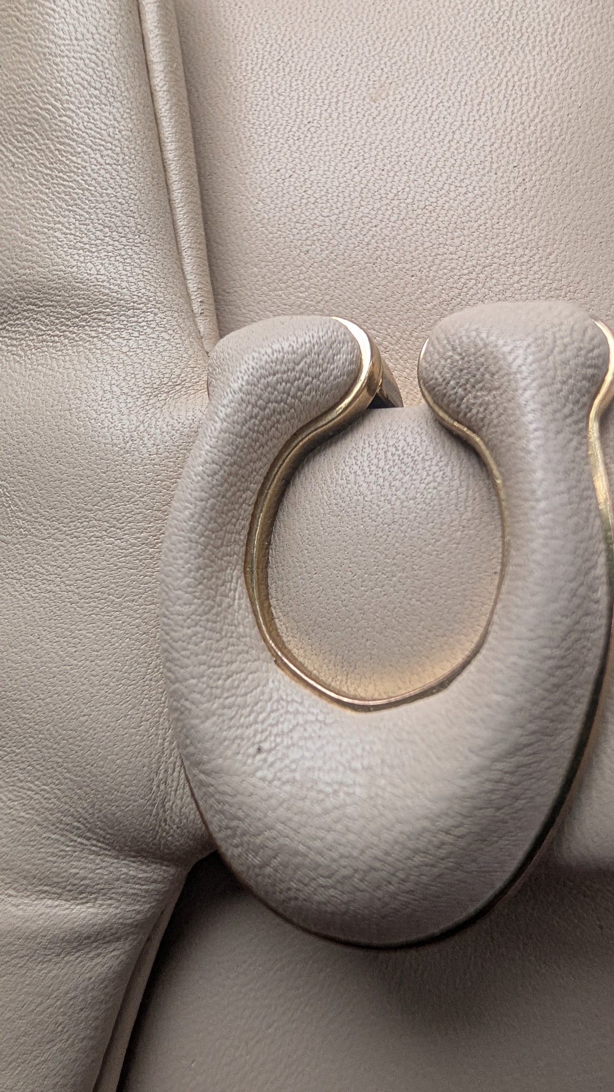 Close-up of a  textured leather bag Pre-Owned Coach Pillow Tabby Shoulder Bag – Cream/Ivory Leather